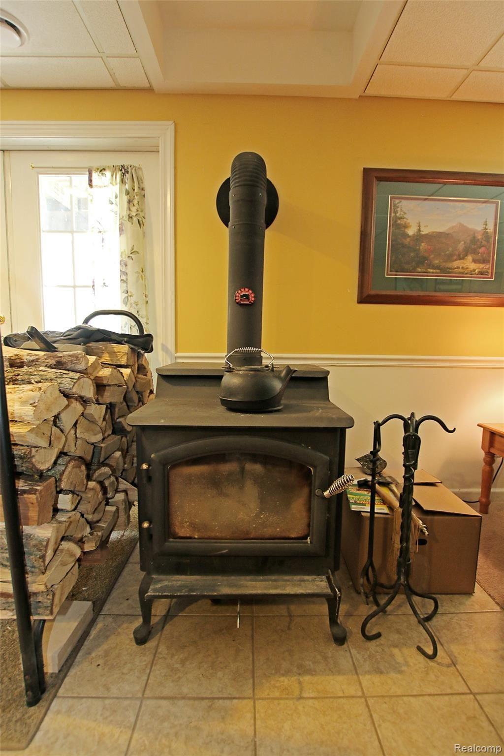9026 Washburn Road Goodrich, MI 48438 - Photo 46 of 74 46) Lower Level Fireplace.jpg