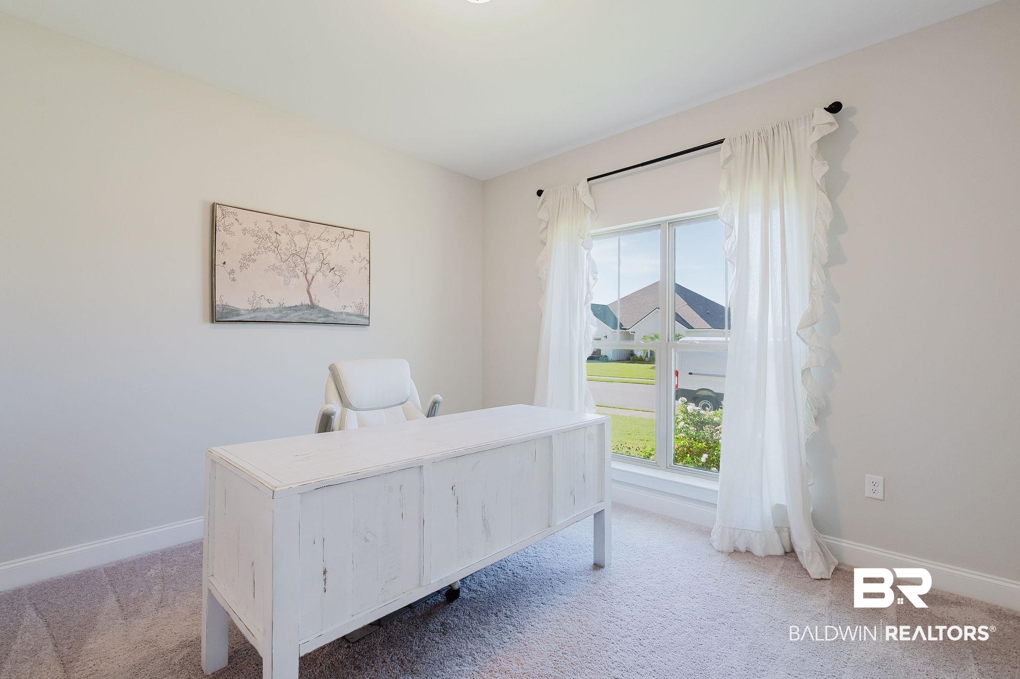 7872 Calverton Street Foley, AL 36535 - Photo 9 of 76 Bright room featuring a large window with white trim, light-toned carpeting, and neutral wall paint