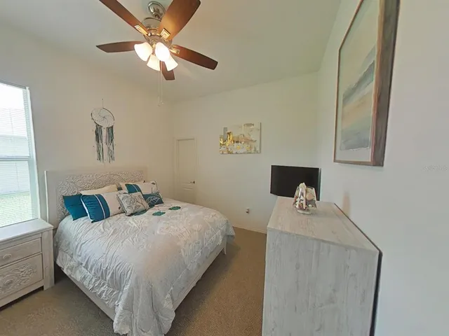 a bathroom with a granite countertop sink a mirror and a shower