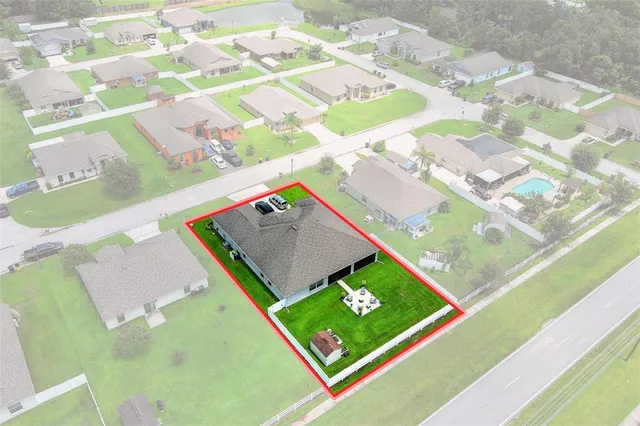 an aerial view of an house with a garden