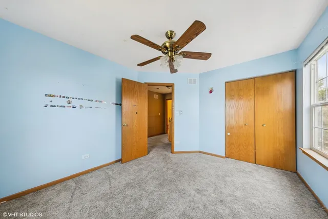 a spacious bathroom with a bathtub shower sink mirror vanity and toilet