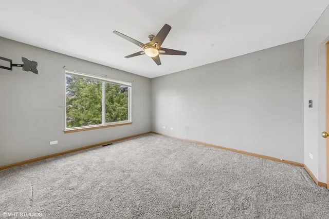 an empty room with windows and entrance