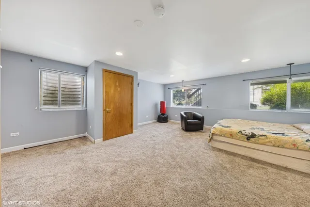 a bedroom with furniture and a window