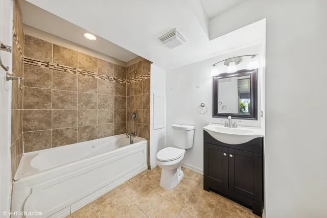 a view of balcony with seating and trees in the background