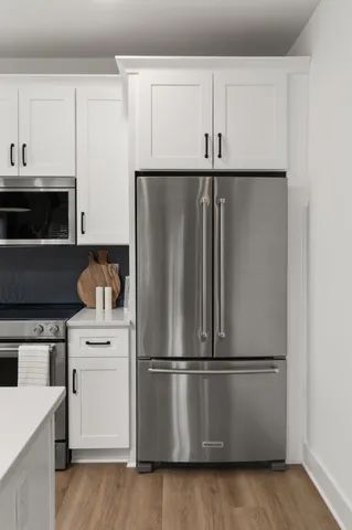 a kitchen with cabinets and stainless steel appliances