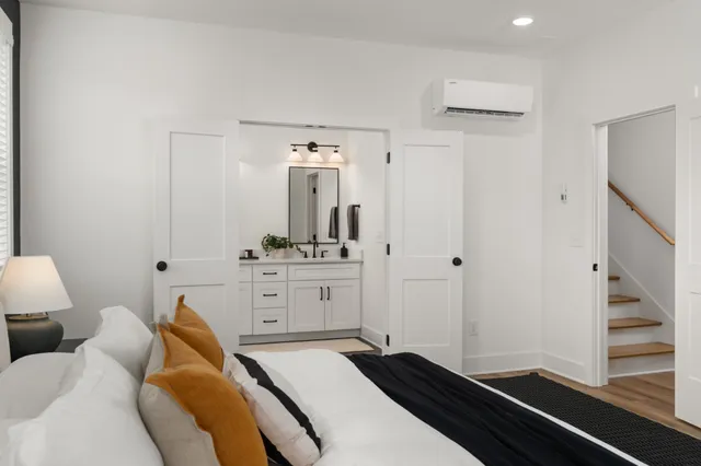 a spacious bathroom with a double vanity sink and a mirror