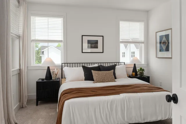 a bedroom with bed and window