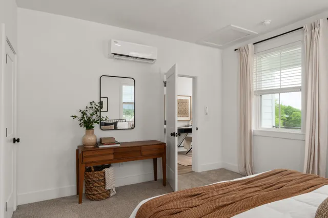 a bedroom with a bed and a table