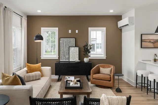 a living room with furniture and a window