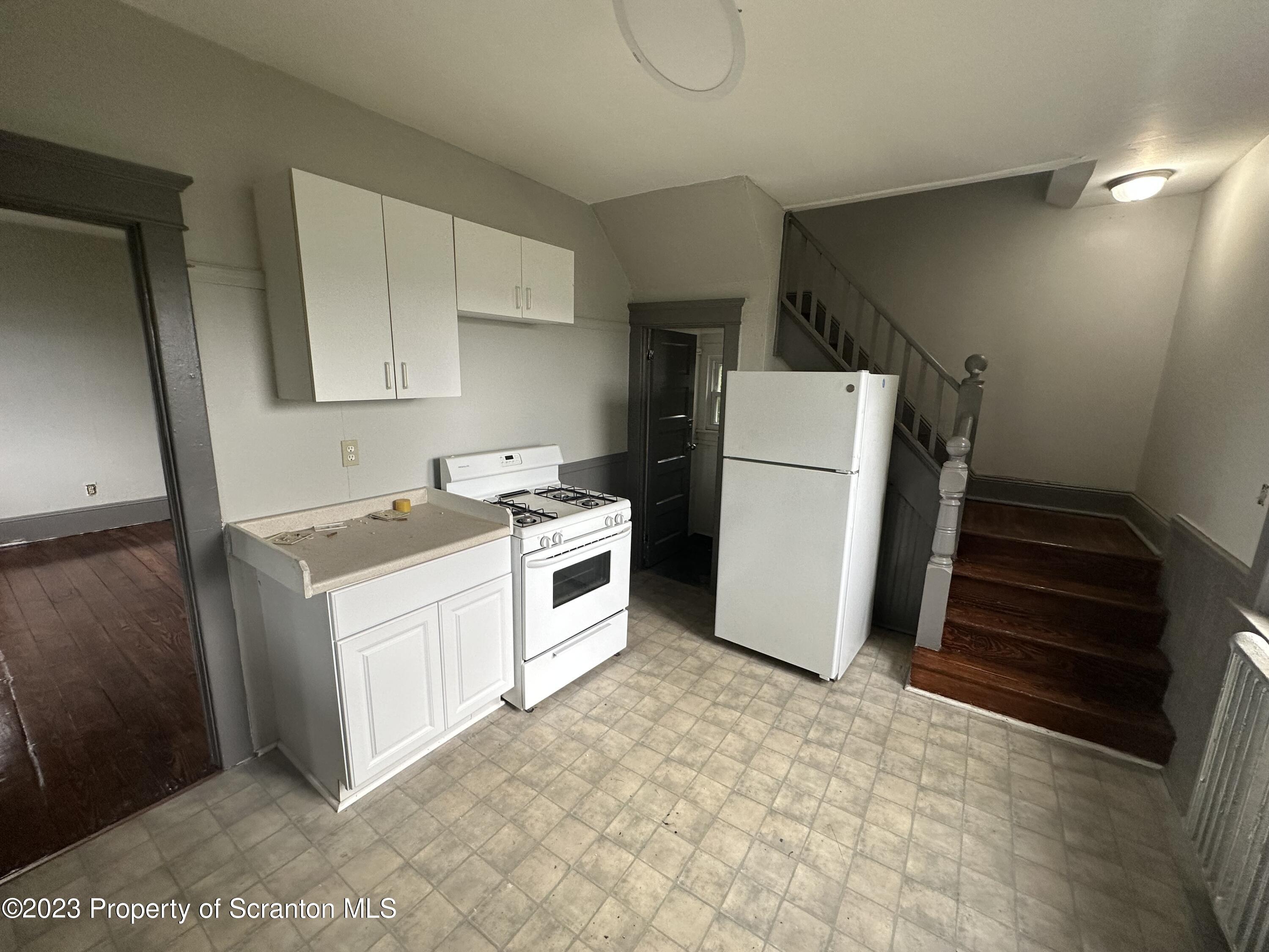 930 South Hanover Street Nanticoke, PA 18634 - Photo 4 of 9 a utility room with dryer and washer