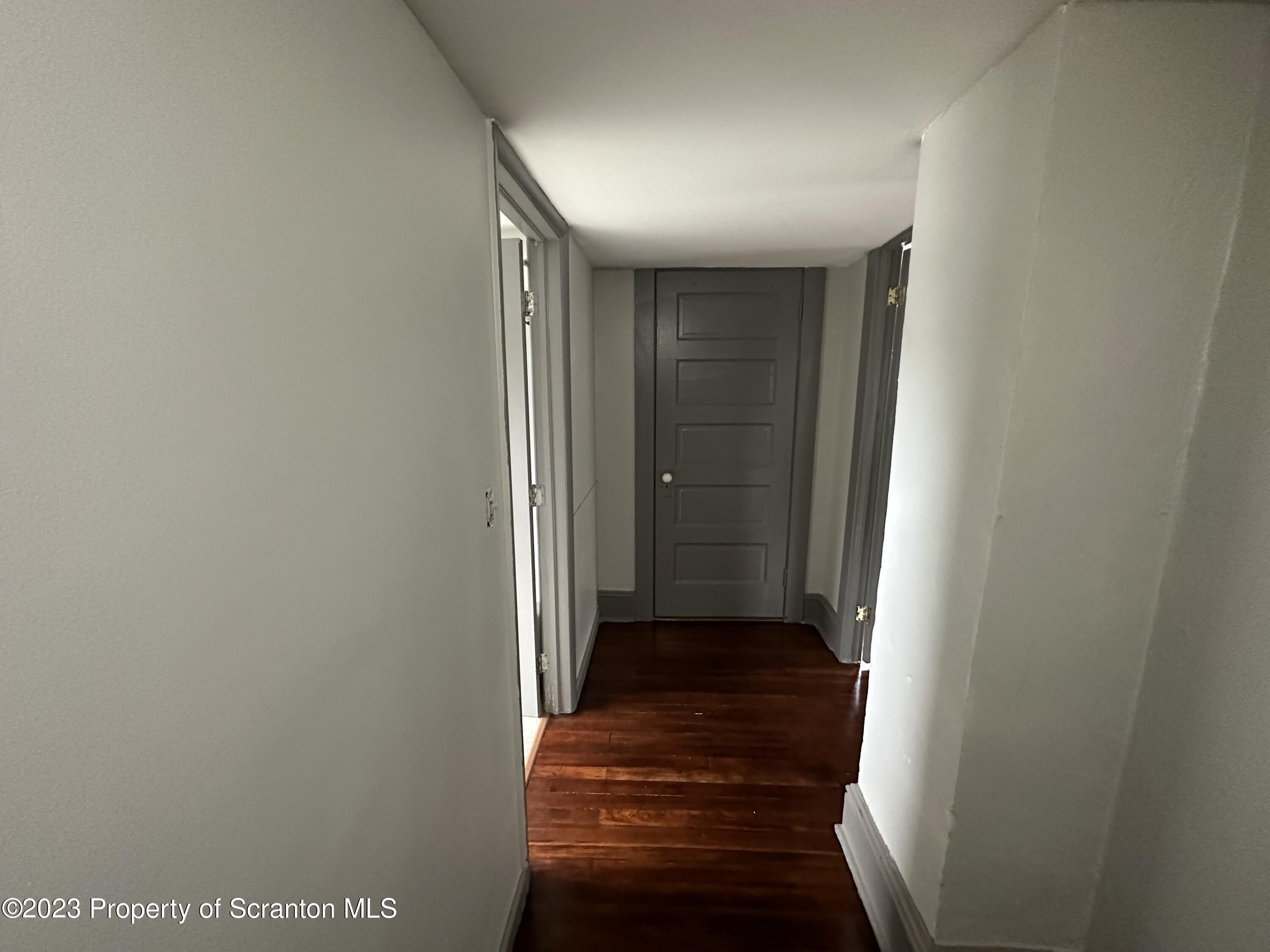 930 South Hanover Street Nanticoke, PA 18634 - Photo 5 of 9 a view of a hallway with wooden floor