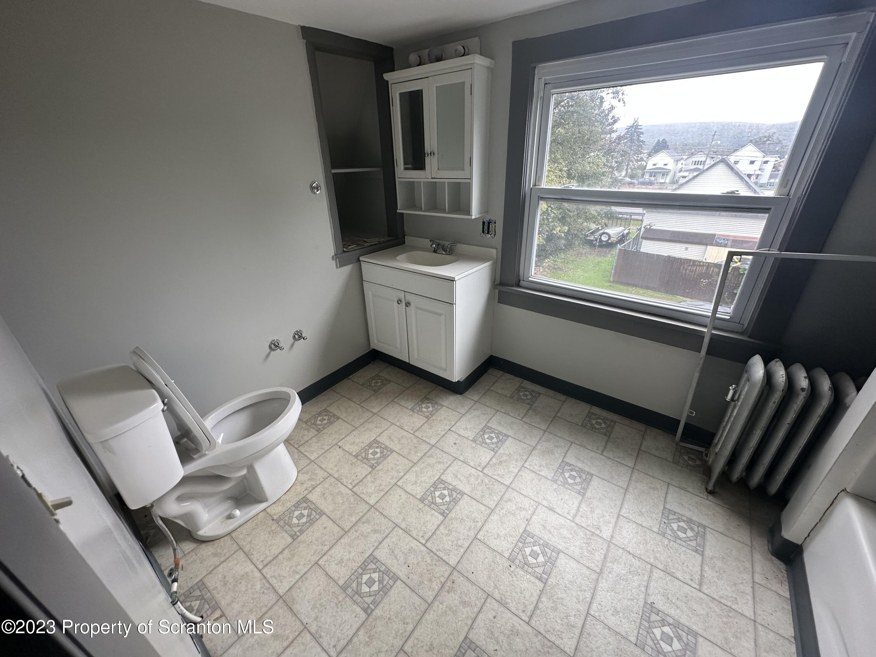 930 South Hanover Street Nanticoke, PA 18634 - Photo 6 of 9 a view of a hardwood floor and staircase