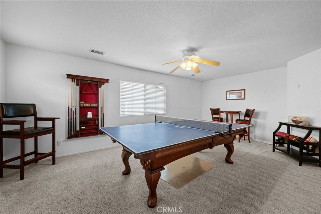 7220 Cumberland Place Rancho Cucamonga, CA 91739 - Photo 26 of 41 Versatile upstairs loft, with plush carpet, offers space for a game room, media area, or additional living space. The pool table and accessories are included in the sale.