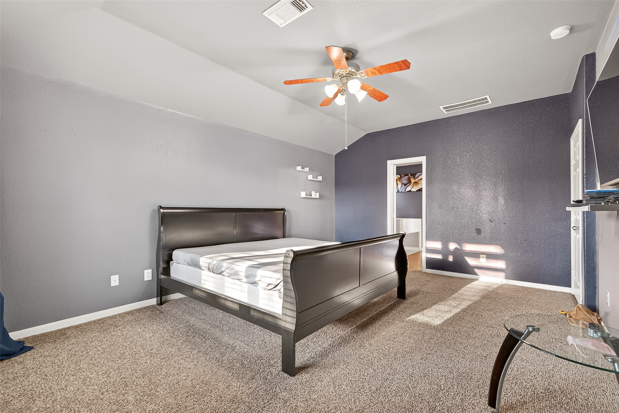 16715 Mackenzie Mesa Drive Spring, TX 77379 - Photo 35 of 50 a bedroom with a bed and a chandelier
