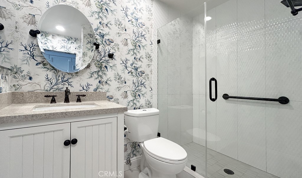 33902 Faeroe Bay Dana Point, CA 92629 - Photo 12 of 22 a bathroom with a sink toilet and shower