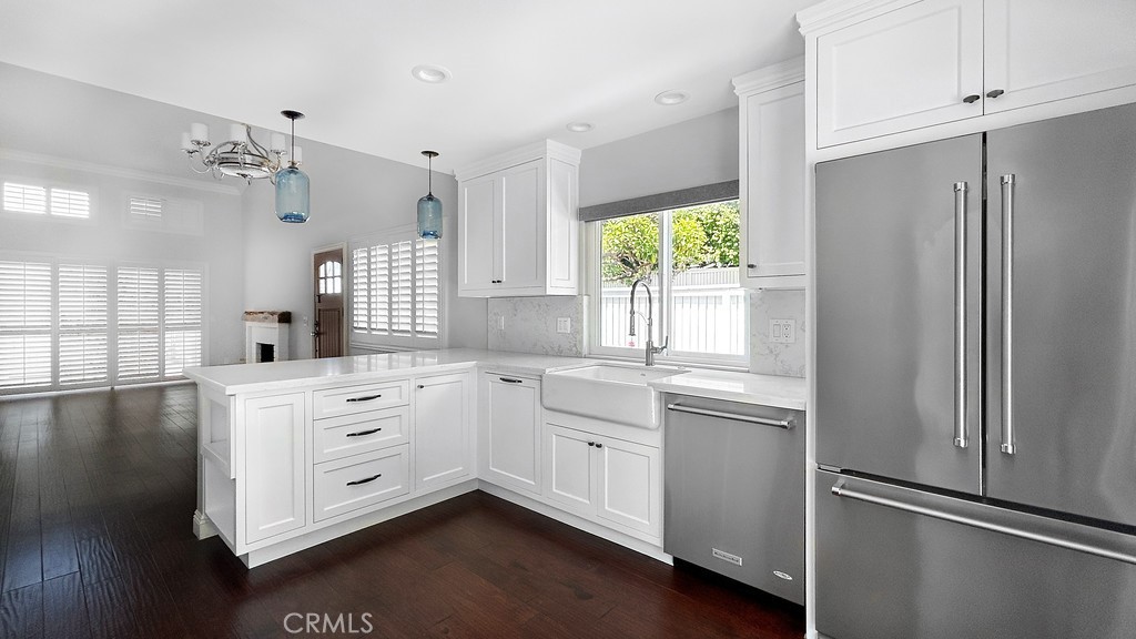 33902 Faeroe Bay Dana Point, CA 92629 - Photo 5 of 22 a kitchen with white cabinets and window