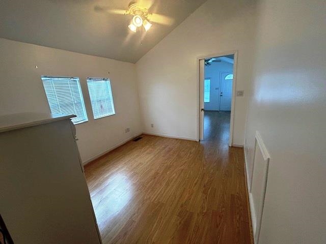 6 Robin Avenue Myrtle Beach, SC 29572 - Photo 11 of 24 Spare room featuring light wood finished floors, vaulted ceiling, ceiling fan, and plenty of natural light