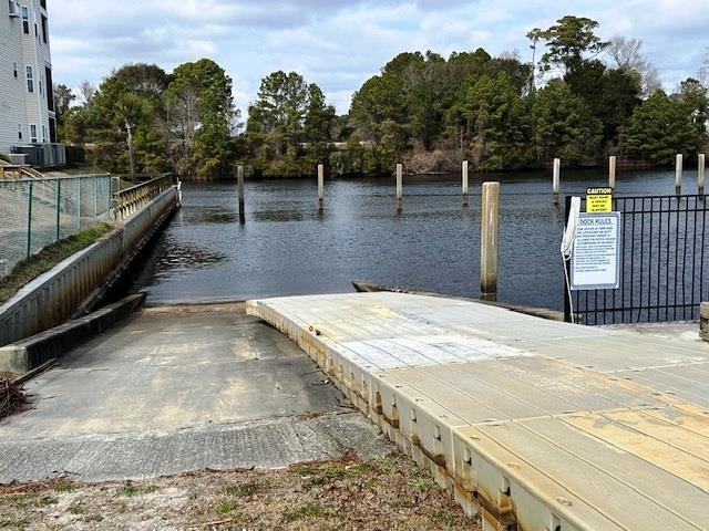 6 Robin Avenue Myrtle Beach, SC 29572 - Photo 20 of 24 Dock featuring a boat ramp and a water view