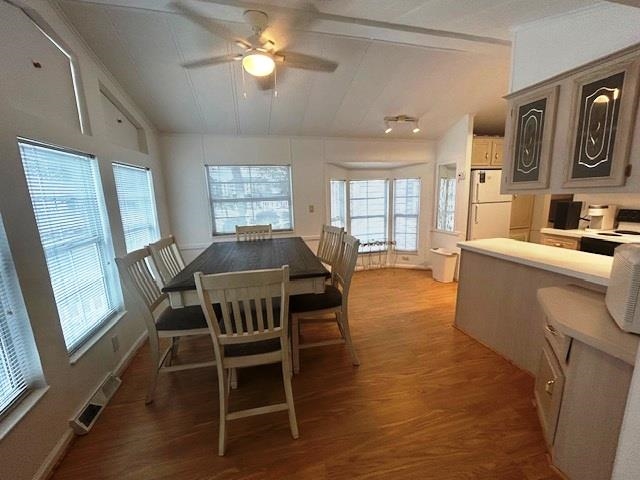 6 Robin Avenue Myrtle Beach, SC 29572 - Photo 2 of 24 Dining area with light wood-style flooring, vaulted ceiling, and a ceiling fan