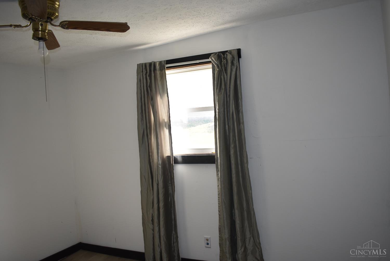 374 Exline Road Wellston, OH 45692 - Photo 24 of 33 ceiling fan laminate flooring in bedroom