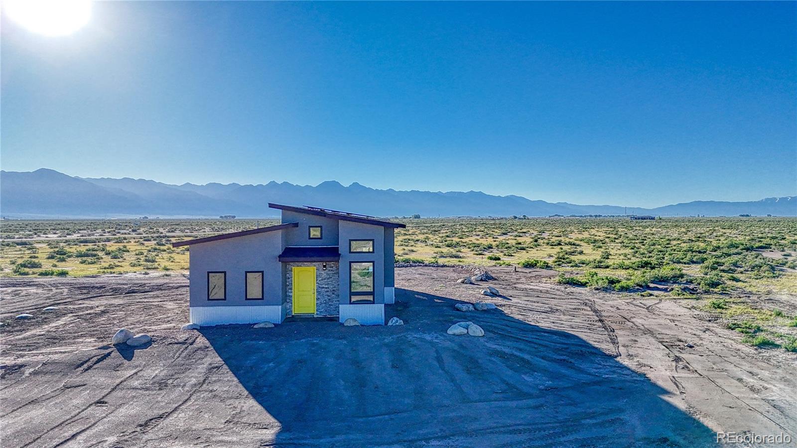 57884 Co Road Moffat, CO 81143 - Photo 12 of 40 a view of a room with wooden floor and a large window