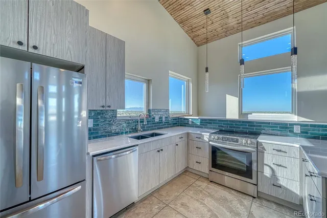 a kitchen with a stove and a refrigerator