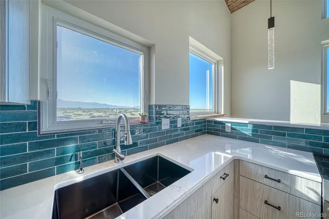 a kitchen with a sink and a window