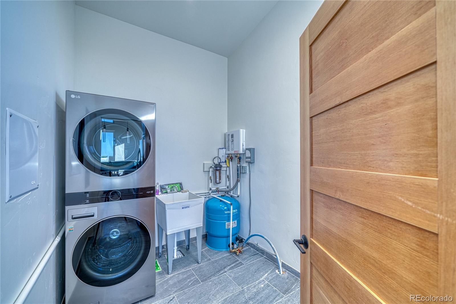 57884 Co Road Moffat, CO 81143 - Photo 35 of 40 a view of a bedroom with washer and dryer