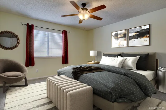 a bedroom with two beds and a window