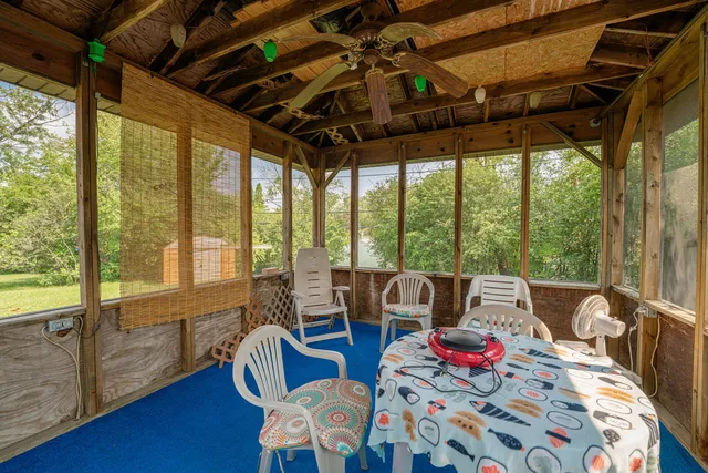 a living room with furniture and a bed