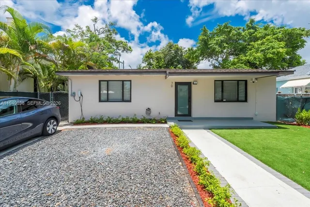 front view of a house with a yard