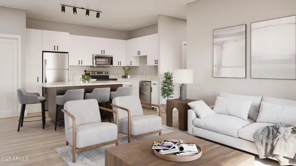 a living room with furniture kitchen and a table