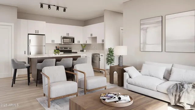 a living room with furniture kitchen and a table