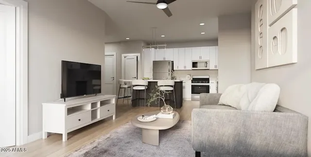 a living room with furniture and a flat screen tv