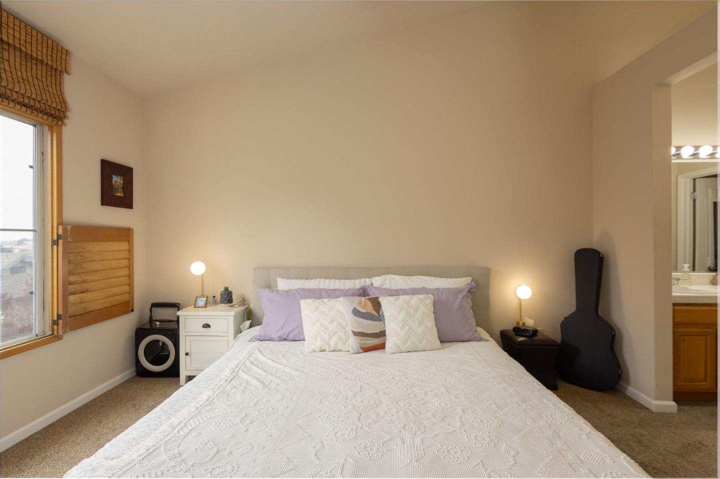 10 Patrick Way Half Moon Bay, CA 94019 - Photo 9 of 18 a bedroom with a bed and a window