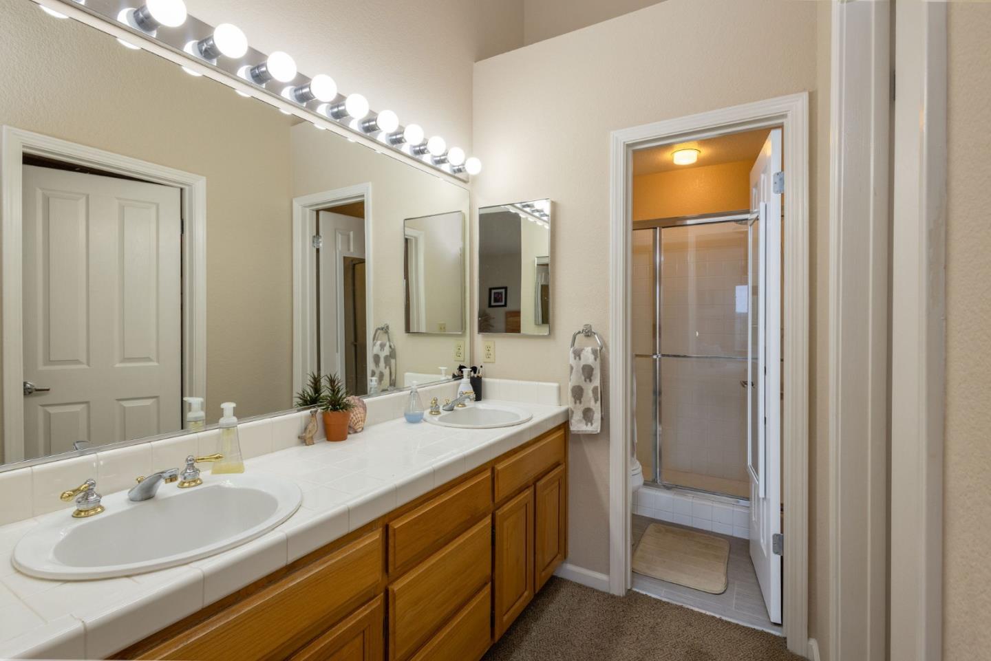 10 Patrick Way Half Moon Bay, CA 94019 - Photo 10 of 18 a bathroom with a sink double vanity and a mirror