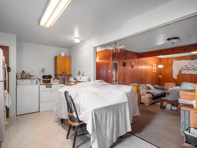 a bedroom with furniture and a window