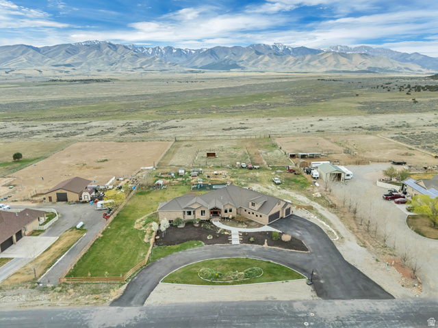 3054 West Ridgeline Road Stockton, UT 84071 - Photo 68 of 88 Aerial view of sparsely populated area with a mountain backdrop