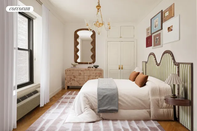 a bedroom with a bed and a dresser