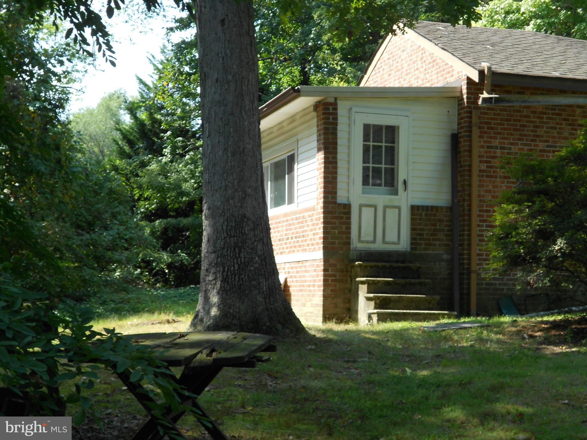 2422 Poplar Road Essex, MD 21221 - Photo 3 of 9 a front view of a house with garden
