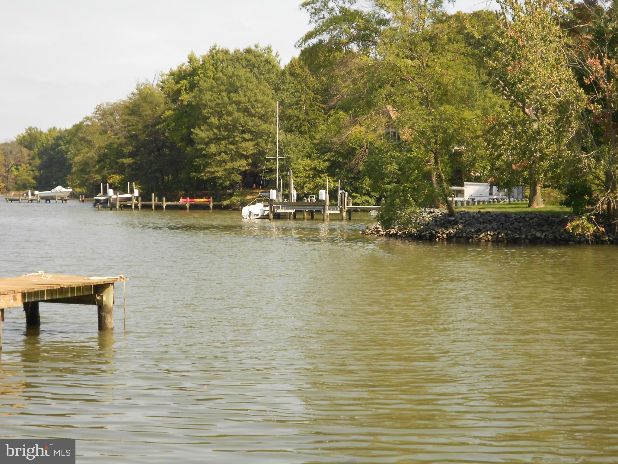 2422 Poplar Road Essex, MD 21221 - Photo 7 of 9 a view of a lake with boats and trees