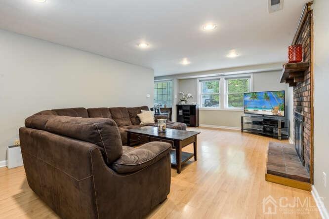 23 Meyer Road Edison, NJ 08817 - Photo 4 of 34 a living room with furniture and a flat screen tv