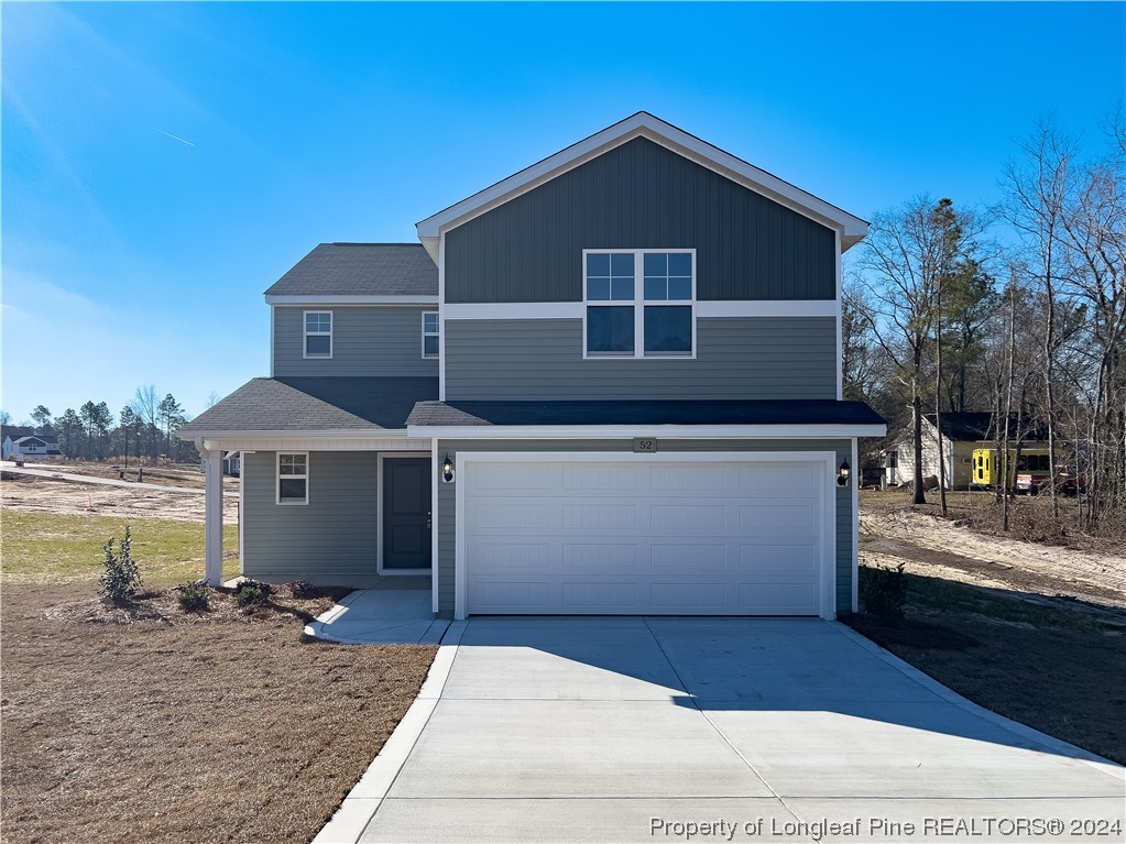 52 Pomeranian (lot 1) Lane Parkton, NC 28371 - Photo 1 of 33 a front view of a house with yard