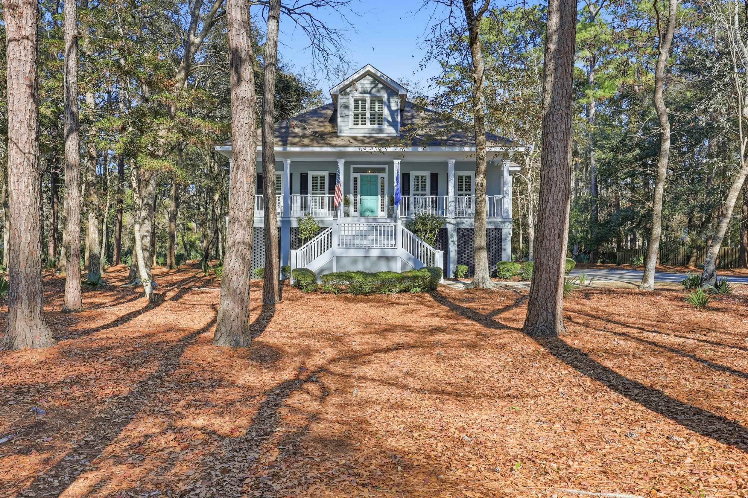 213 Old Carriage Loop Georgetown, SC 29440 - Photo 3 of 40 Coastal inspired home with a porch and stairway