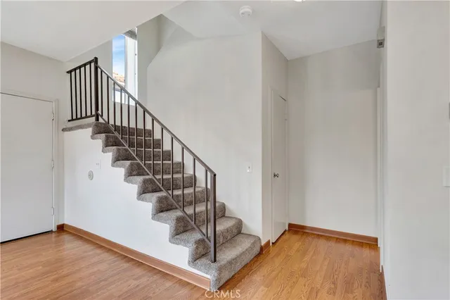a view of entryway with wooden floor