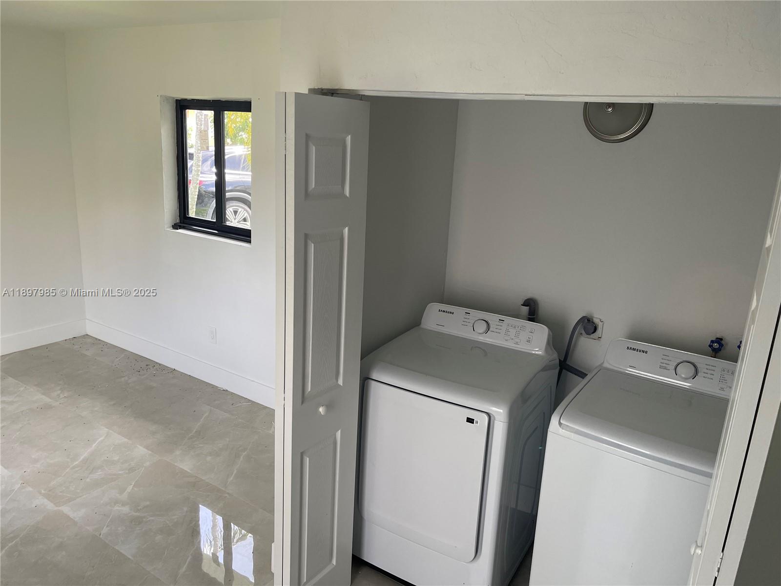 4310 Northwest 182nd Street Miami Gardens, FL 33055 - Photo 8 of 12 a utility room with dryer and washer