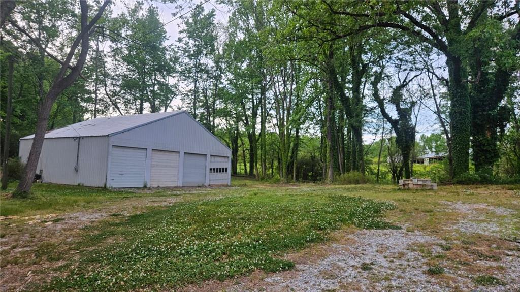 471 Perkins Circle Canton, GA 30115 - Photo 5 of 20 a big yard with large trees