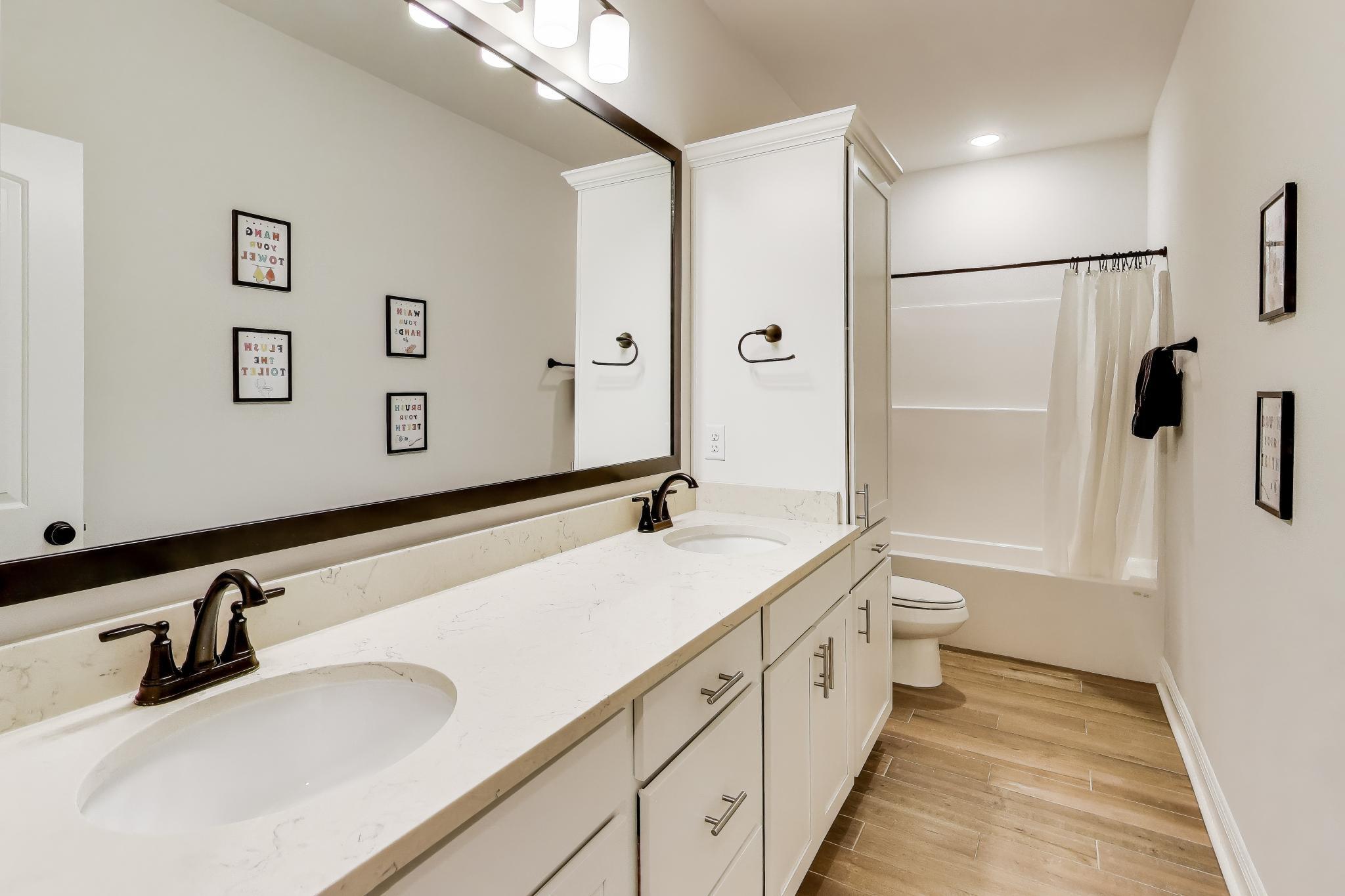 46 East Tweet Street Freeport, FL 32439 - Photo 16 of 59 a bathroom with a sink and a mirror a toilet