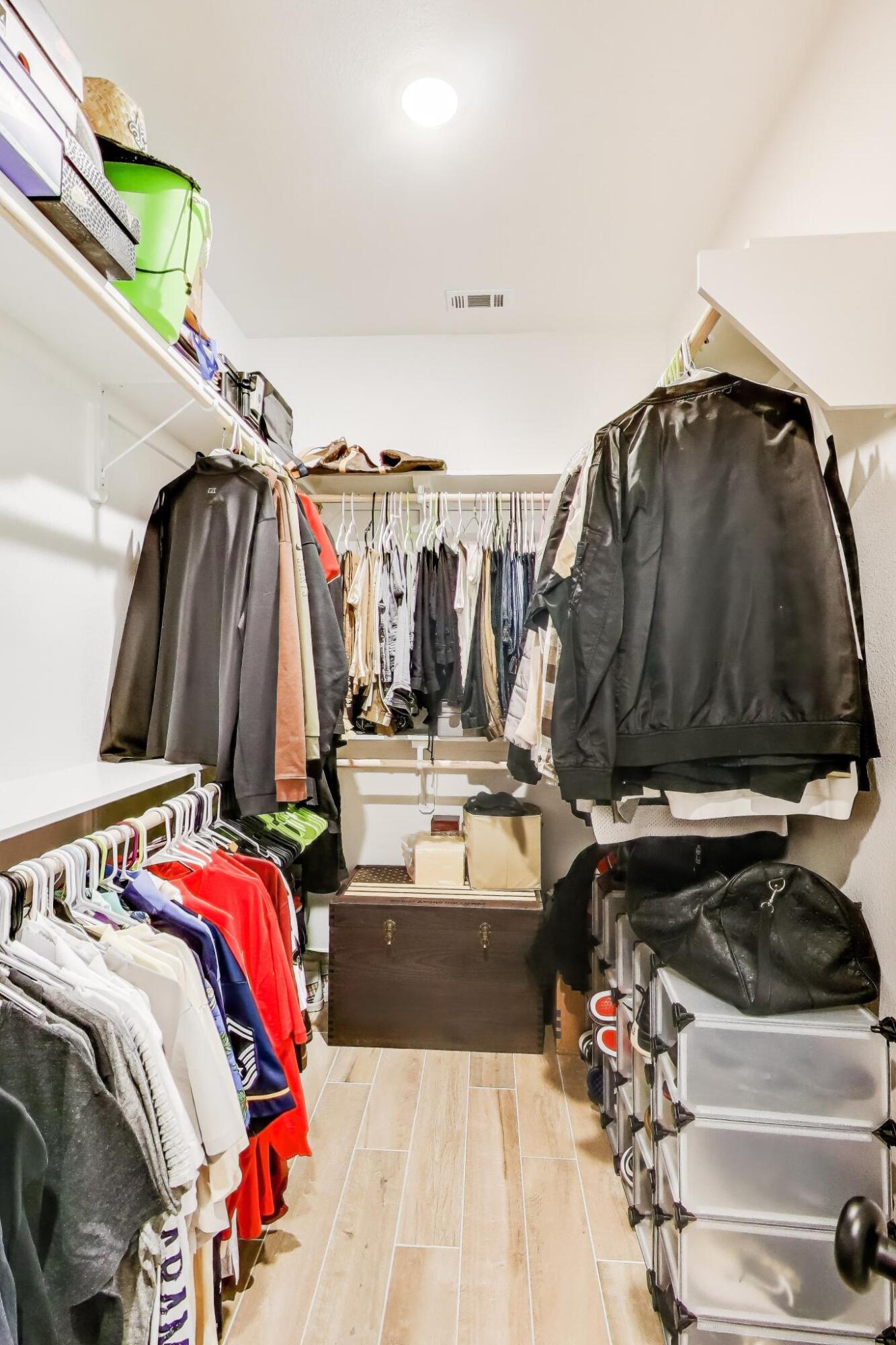 46 East Tweet Street Freeport, FL 32439 - Photo 23 of 59 a view of walk in closet with clothes and shoes