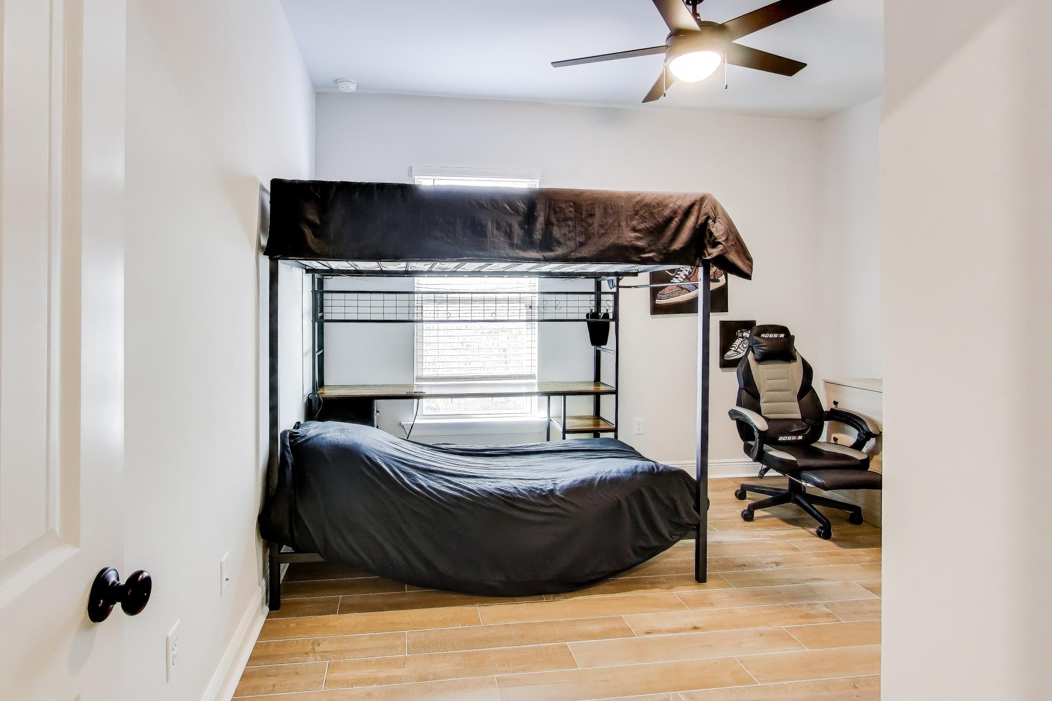 46 East Tweet Street Freeport, FL 32439 - Photo 24 of 59 a bedroom with a bed and a dresser